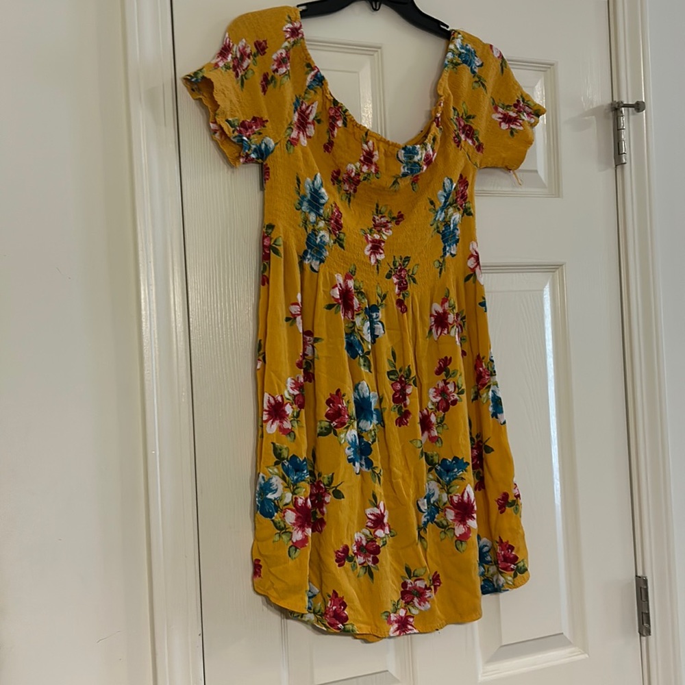 Cute spring dress. Kind of on the shorter side. Off the shoulder.